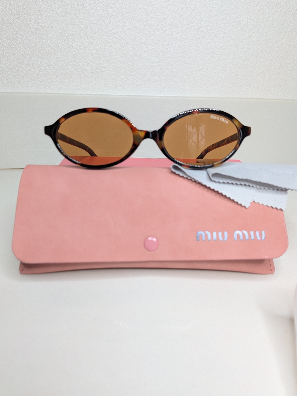 Miu Miu Tortoiseshell Oval Sunglasses in Brown - Picture 6 of 11